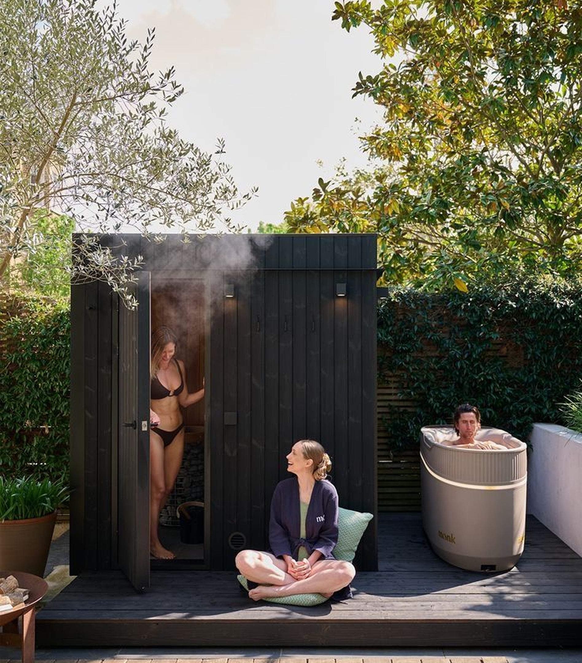 People enjoying sauna and cold plunge at Recovr Club